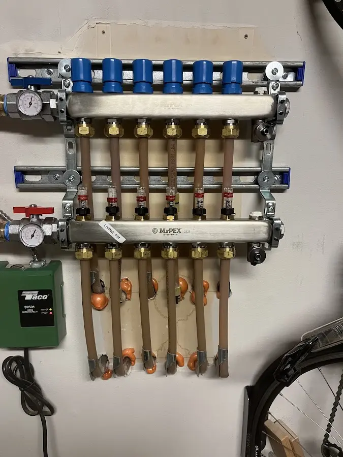 Plumber performing Water Heater Repair at a residential property in Colchester